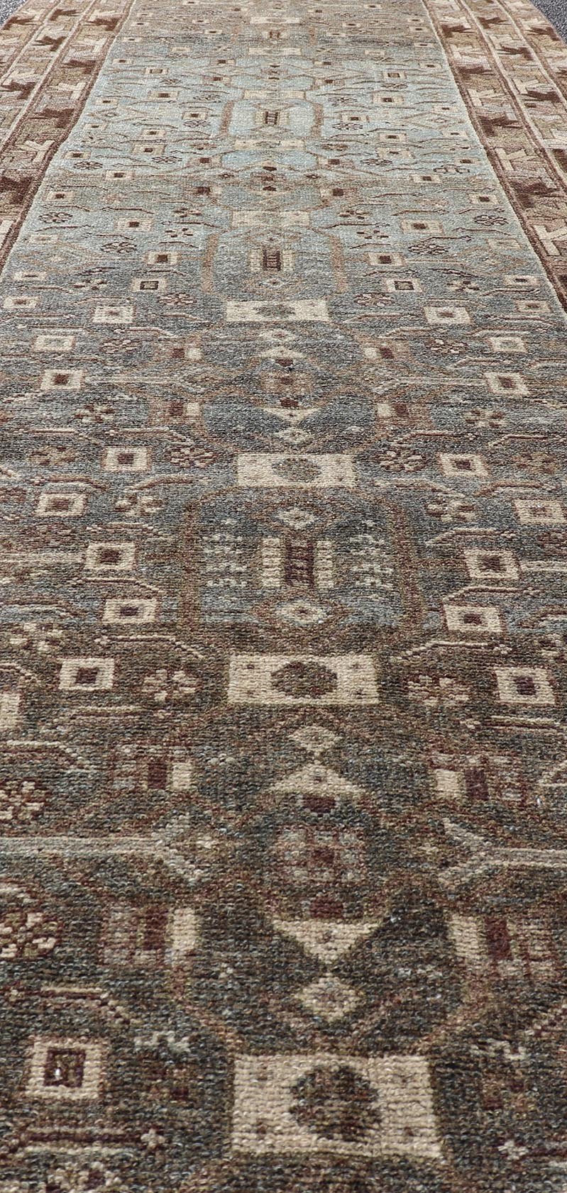 Antique N.W. Persian Runner with All - Over Design in Light Brown, L. Blue & Gray. Keivan Woven Arts; rug EMB - 22125 - 15015, country of origin / type: Iran / Hamadan, circa 1910. Measures: 3'4 x 12'7 This antique N.W. Persian runner has be... - Keivan Woven ArtsEMB - 22125 - 15015 - 20343Rug