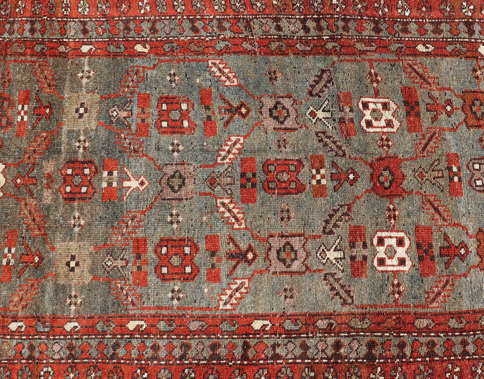Measures: 3'6 x 13'1 This early 20th century antique Kurdish runner features a all - over tribal motifs with blue, gray, teal, and soft orange red. Kurdish Antique Runner in Vibrant Blue - Teal Background and Multi - Tiered Border. Keivan Woven Arts; rug... - Keivan Woven ArtsEMB - 22131 - 15018 - 20361Rug