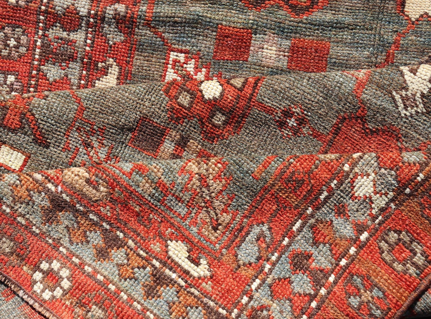 Measures: 3'6 x 13'1 This early 20th century antique Kurdish runner features a all - over tribal motifs with blue, gray, teal, and soft orange red. Kurdish Antique Runner in Vibrant Blue - Teal Background and Multi - Tiered Border. Keivan Woven Arts; rug... - Keivan Woven ArtsEMB - 22131 - 15018 - 20361Rug