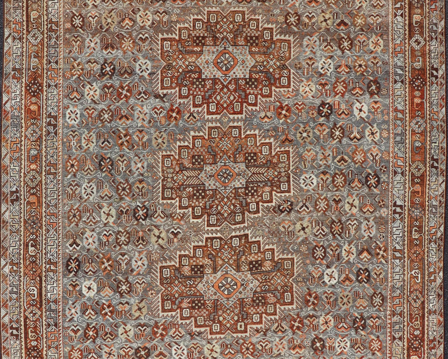 Measures: 6'10 x 9'0 Geometric Persian Shiraz Rug with Tri - Medallion Design in Shades Orange and Blue. Keivan Woven Arts / rug EMB - 22132 - 15042, country of origin / type: Iran / Shiraz, circa 1910. This Persian Shiraz rug (circa early 20th ce... - Keivan Woven ArtsEMB - 22132 - 15042 - 20487Rug
