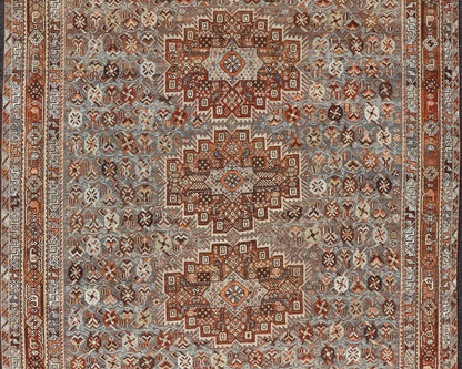 Measures: 6'10 x 9'0 Geometric Persian Shiraz Rug with Tri - Medallion Design in Shades Orange and Blue. Keivan Woven Arts / rug EMB - 22132 - 15042, country of origin / type: Iran / Shiraz, circa 1910. This Persian Shiraz rug (circa early 20th ce... - Keivan Woven ArtsEMB - 22132 - 15042 - 20487Rug