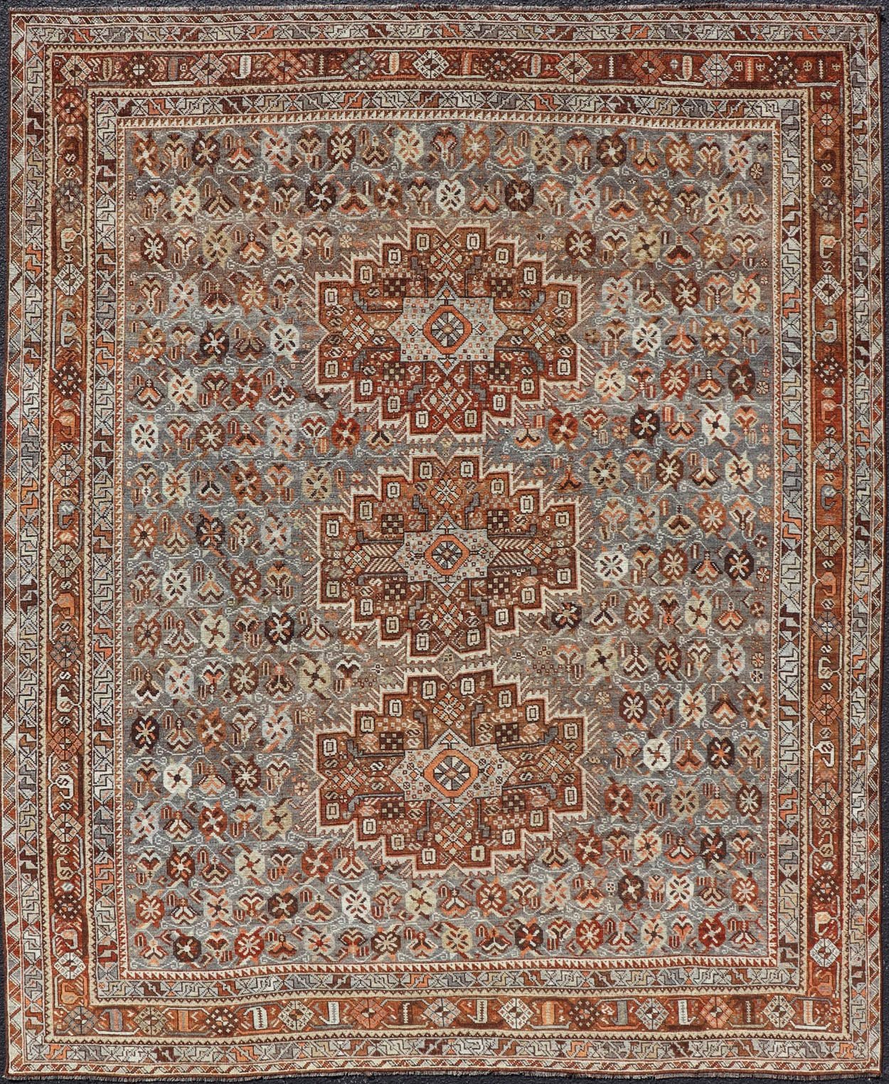 Measures: 6'10 x 9'0 Geometric Persian Shiraz Rug with Tri - Medallion Design in Shades Orange and Blue. Keivan Woven Arts / rug EMB - 22132 - 15042, country of origin / type: Iran / Shiraz, circa 1910. This Persian Shiraz rug (circa early 20th ce... - Keivan Woven ArtsEMB - 22132 - 15042 - 20487Rug