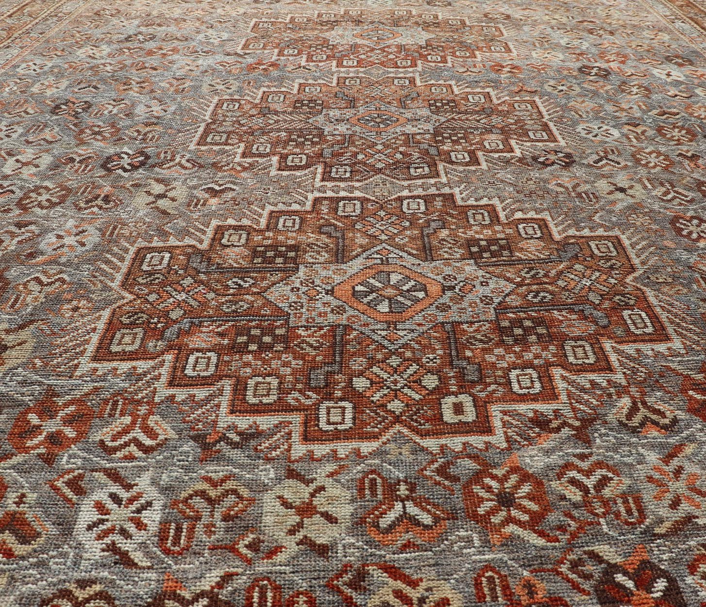 Measures: 6'10 x 9'0 Geometric Persian Shiraz Rug with Tri - Medallion Design in Shades Orange and Blue. Keivan Woven Arts / rug EMB - 22132 - 15042, country of origin / type: Iran / Shiraz, circa 1910. This Persian Shiraz rug (circa early 20th ce... - Keivan Woven ArtsEMB - 22132 - 15042 - 20487Rug