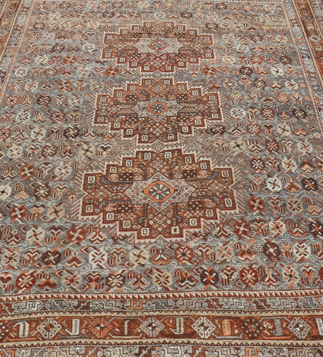 Measures: 6'10 x 9'0 Geometric Persian Shiraz Rug with Tri - Medallion Design in Shades Orange and Blue. Keivan Woven Arts / rug EMB - 22132 - 15042, country of origin / type: Iran / Shiraz, circa 1910. This Persian Shiraz rug (circa early 20th ce... - Keivan Woven ArtsEMB - 22132 - 15042 - 20487Rug
