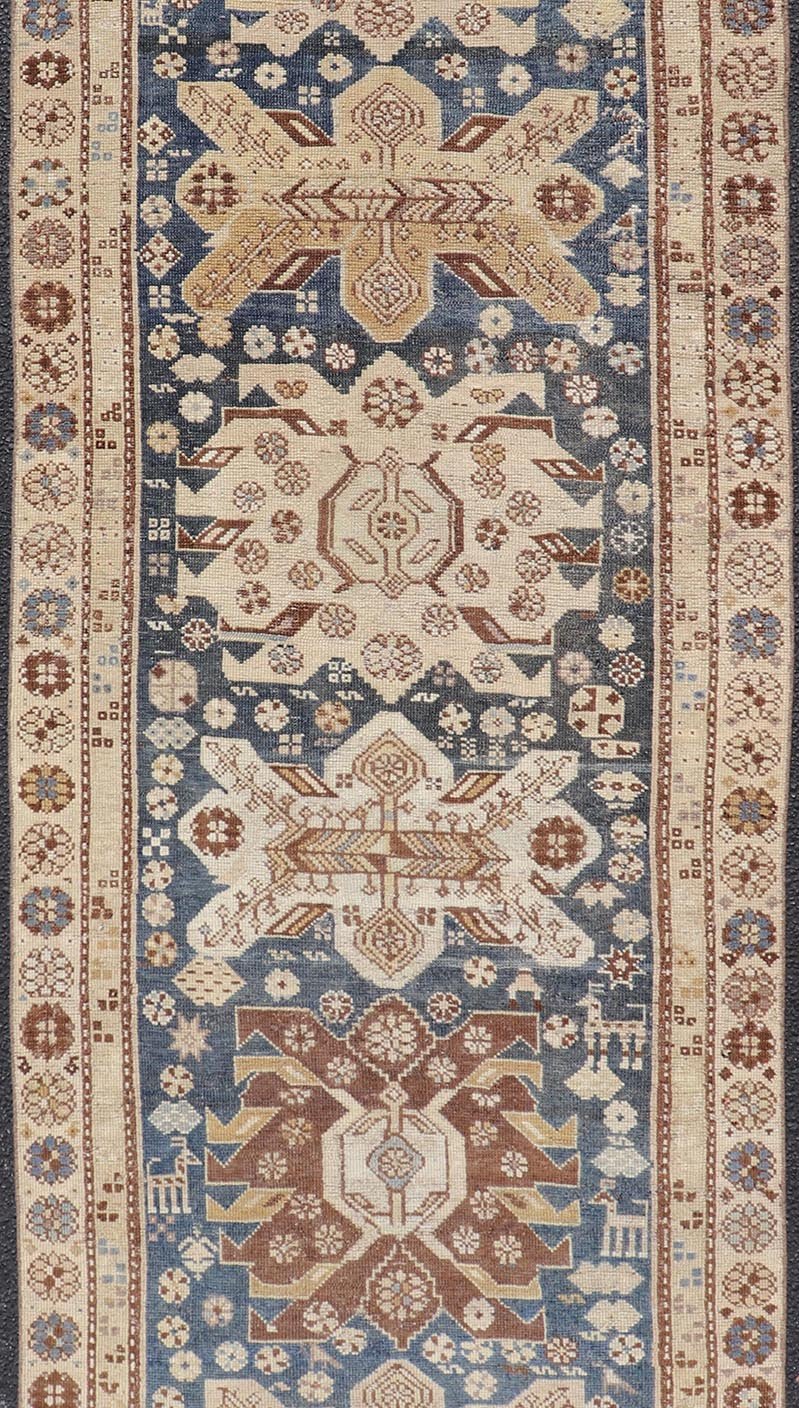 Persian Kurdish Antique Runner with Tribal Medallion Design On Navy Blue Field Keivan Woven Arts / rug EMB - 22146 - 15077, country of origin / type: Iran / Kurdish, circa 1900. Measures: 2'11 x 8'6 Antique Kurdish runner with tribal geometric m... - Keivan Woven ArtsEMB - 22146 - 15077 - 20679