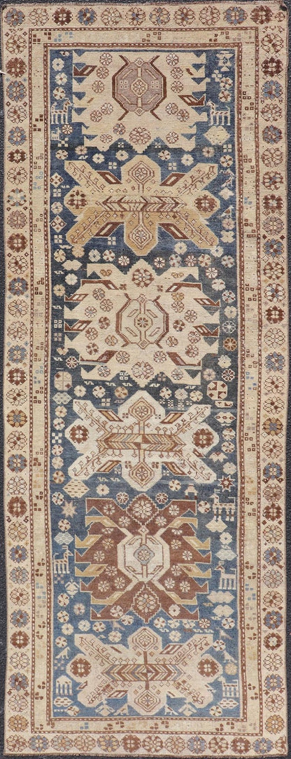 Persian Kurdish Antique Runner with Tribal Medallion Design On Navy Blue Field Keivan Woven Arts / rug EMB - 22146 - 15077, country of origin / type: Iran / Kurdish, circa 1900. Measures: 2'11 x 8'6 Antique Kurdish runner with tribal geometric m... - Keivan Woven ArtsEMB - 22146 - 15077 - 20679Rug