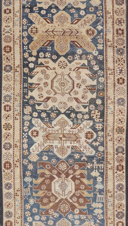 Persian Kurdish Antique Runner with Tribal Medallion Design On Navy Blue Field Keivan Woven Arts / rug EMB - 22146 - 15077, country of origin / type: Iran / Kurdish, circa 1900. Measures: 2'11 x 8'6 Antique Kurdish runner with tribal geometric m... - Keivan Woven ArtsEMB - 22146 - 15077 - 20679Rug