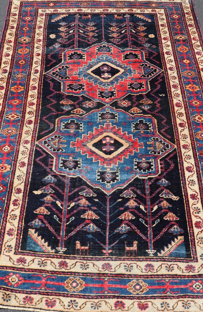 Antique Persian Kurdish Tribal Rug in Sub - Geometric Medallion Design. Country of origin: Iran; Type: Kurdish; Design: Tribal, Floral Tribal; Keivan Woven Arts: EMB - 22151 - 15071. Measures: 4'5 x 7'8 This antique Kurdish rug displays great contrast... - Keivan Woven ArtsEMB - 22151 - 15071 - 20643
