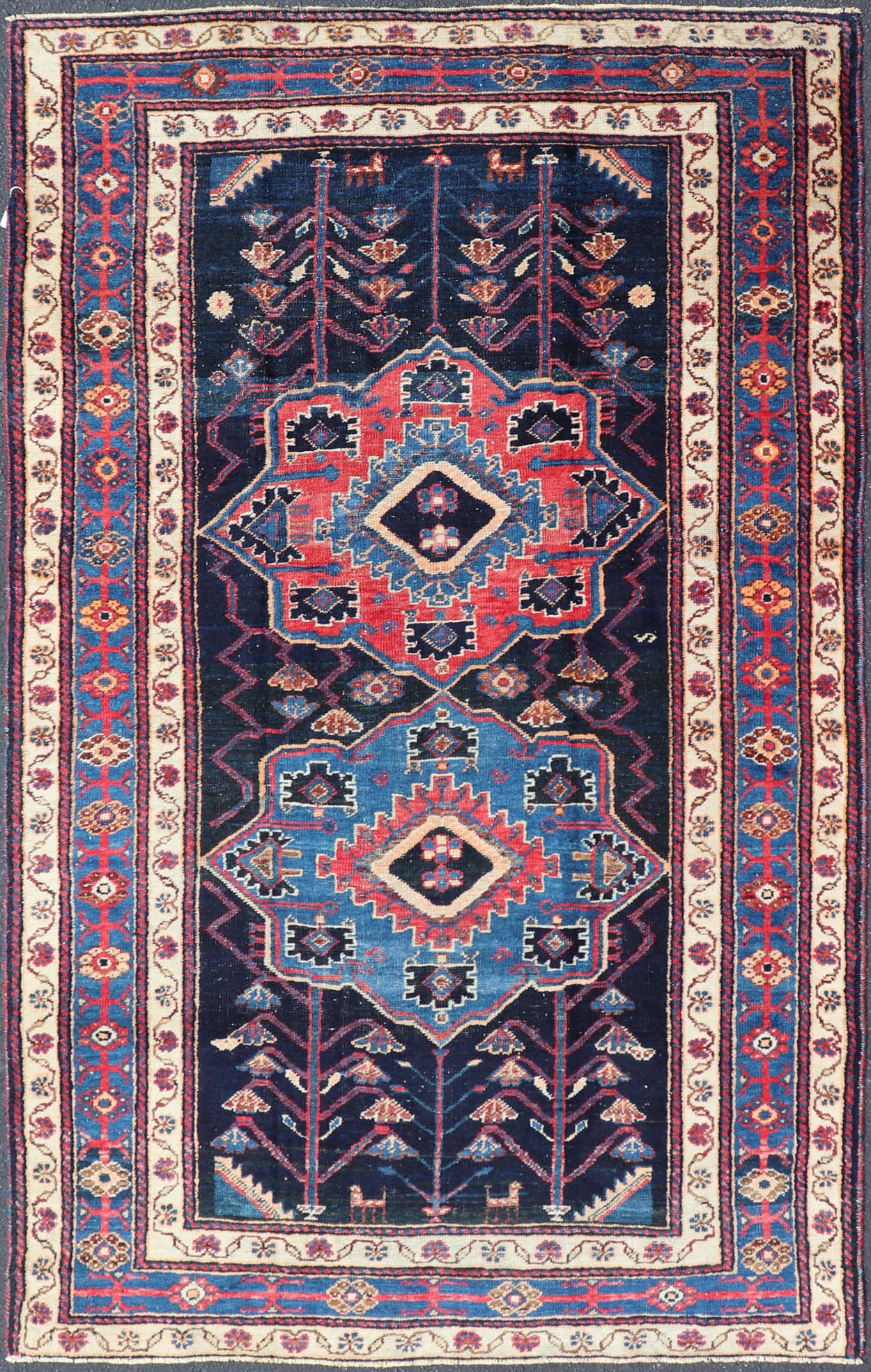Antique Persian Kurdish Tribal Rug in Sub - Geometric Medallion Design. Country of origin: Iran; Type: Kurdish; Design: Tribal, Floral Tribal; Keivan Woven Arts: EMB - 22151 - 15071. Measures: 4'5 x 7'8 This antique Kurdish rug displays great contrast... - Keivan Woven ArtsEMB - 22151 - 15071 - 20643