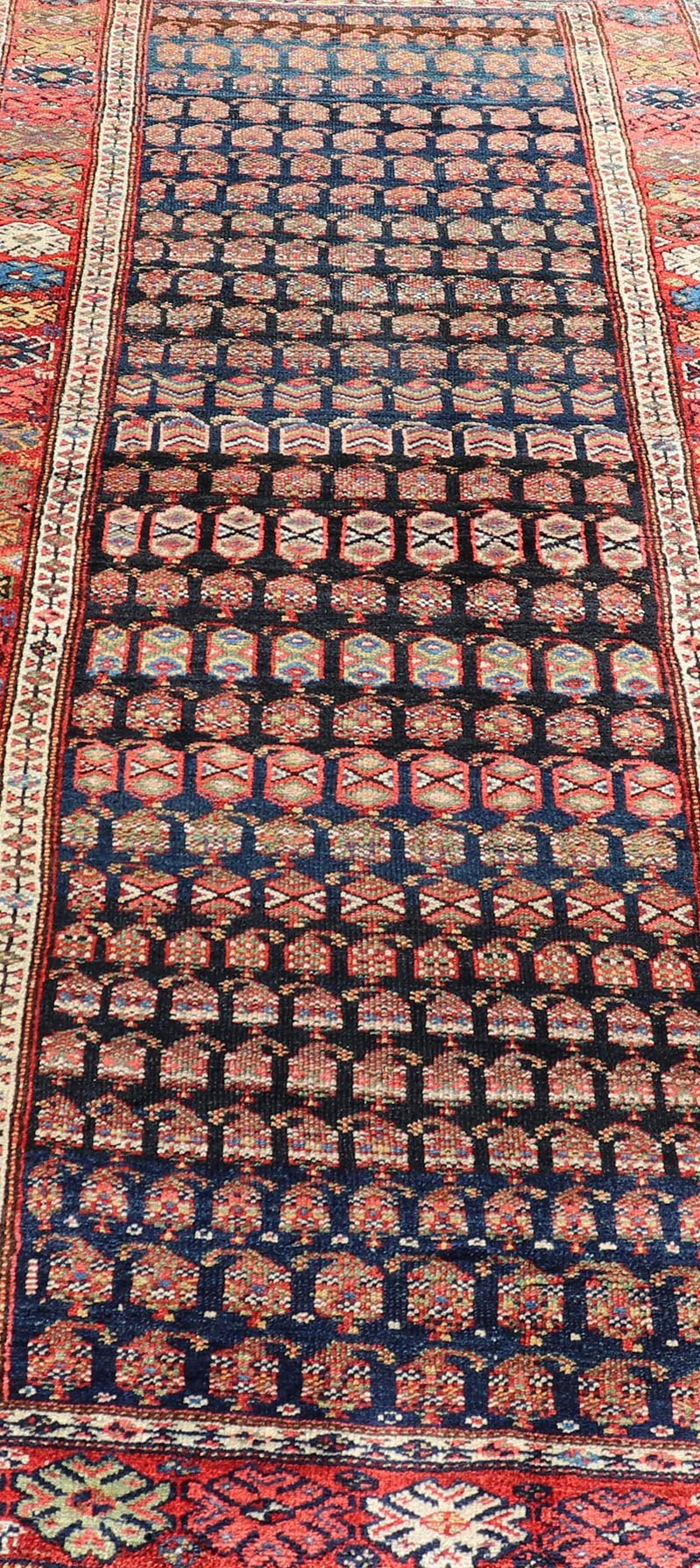Measures: 3'10 x 9'4 Antique Kurdish Gallery Runner In All - Over Geometric Design on a Blue Background. Country of Origin: Iran; Type: Kurdish; Design: Tribal, Floral, Tribal Motif; Keivan Woven Arts: Rug EMB - 22154 - 15074. This antique galler... - Keivan Woven ArtsEMB - 22154 - 15074 - 20661
