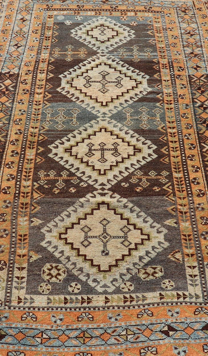 Measures: 4'5 x 8'8 Antique Persian Lori Rug with All - Over Geometric Tribal Medallion Design. Keivan Woven Arts / rug EMB - 22156 - 15069, country of origin / type: Iran / lori, circa 1900 This beautiful antique early 20th century Persian tribal... - Keivan Woven ArtsEMB - 22156 - 15069 - 20637Rug
