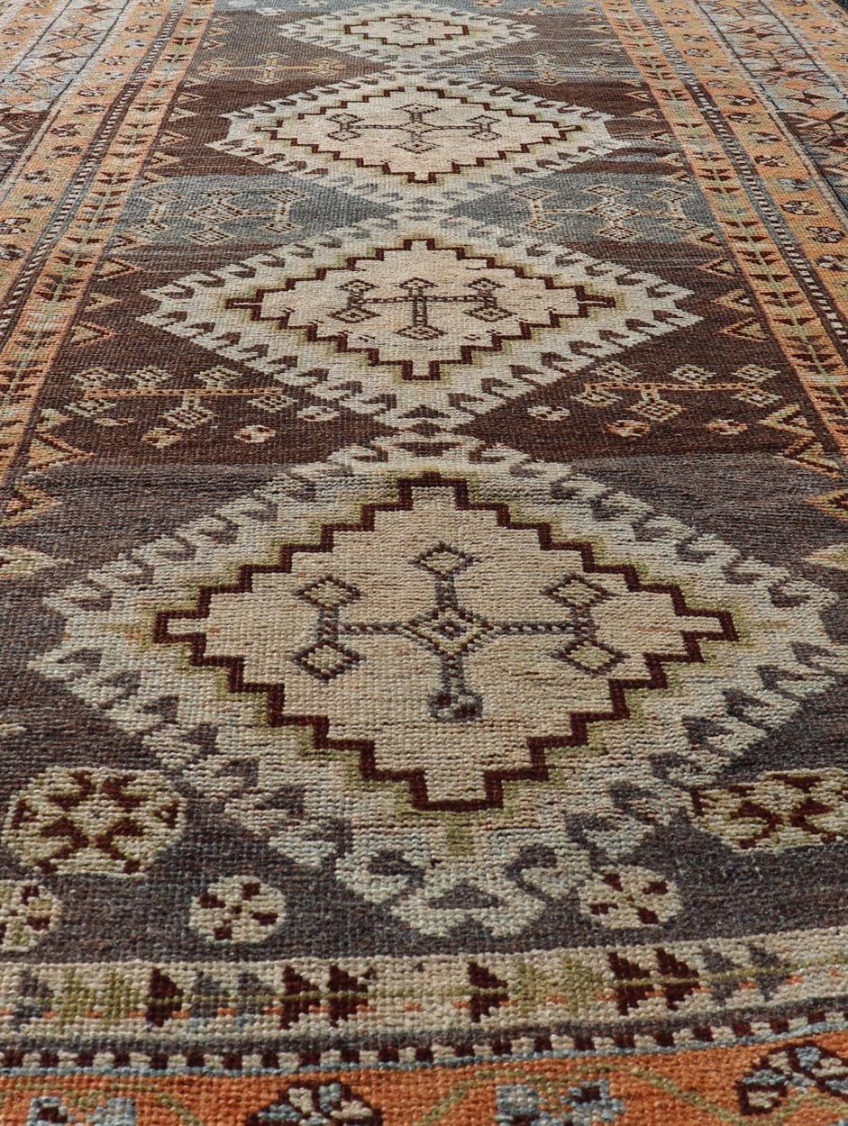 Measures: 4'5 x 8'8 Antique Persian Lori Rug with All - Over Geometric Tribal Medallion Design. Keivan Woven Arts / rug EMB - 22156 - 15069, country of origin / type: Iran / lori, circa 1900 This beautiful antique early 20th century Persian tribal... - Keivan Woven ArtsEMB - 22156 - 15069 - 20637Rug