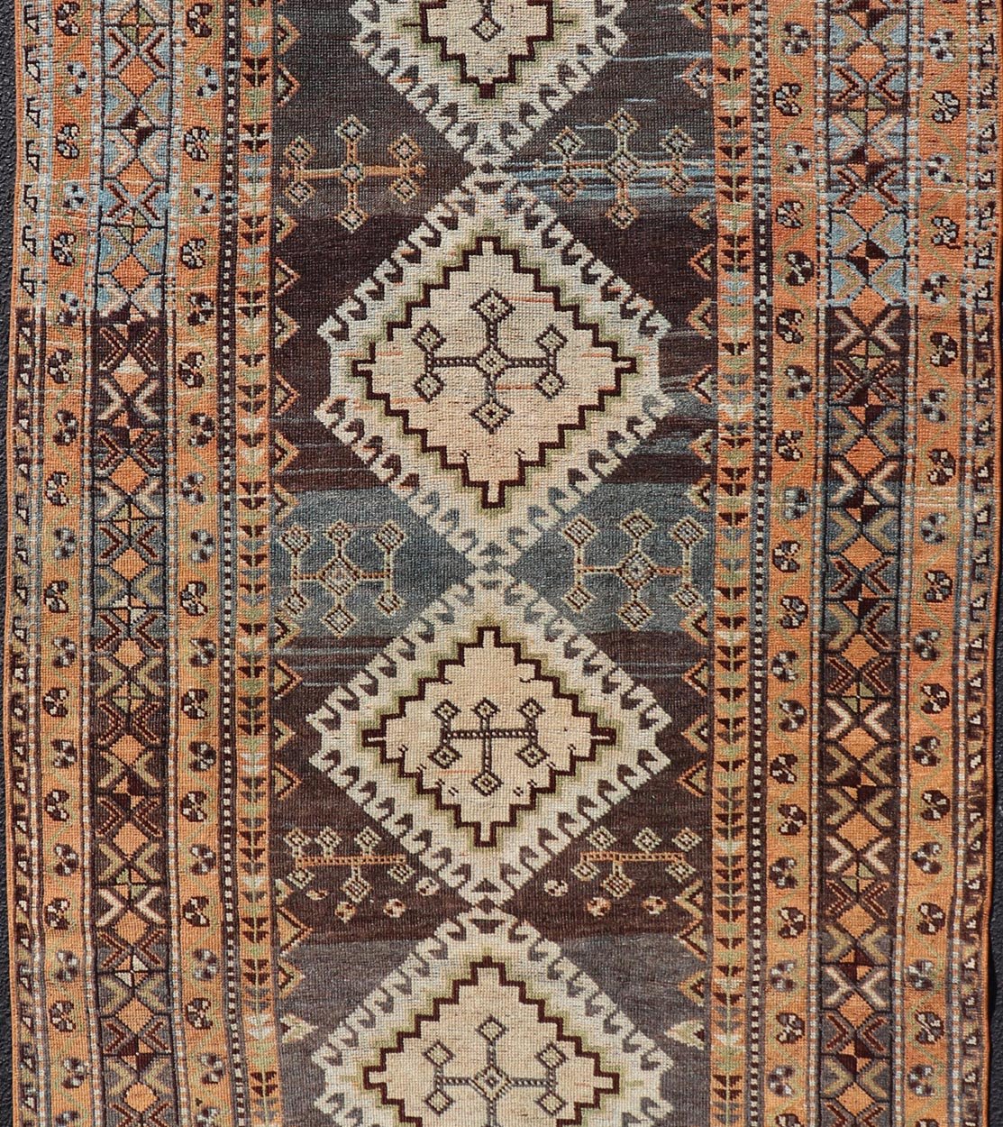 Measures: 4'5 x 8'8 Antique Persian Lori Rug with All - Over Geometric Tribal Medallion Design. Keivan Woven Arts / rug EMB - 22156 - 15069, country of origin / type: Iran / lori, circa 1900 This beautiful antique early 20th century Persian tribal... - Keivan Woven ArtsEMB - 22156 - 15069 - 20637Rug