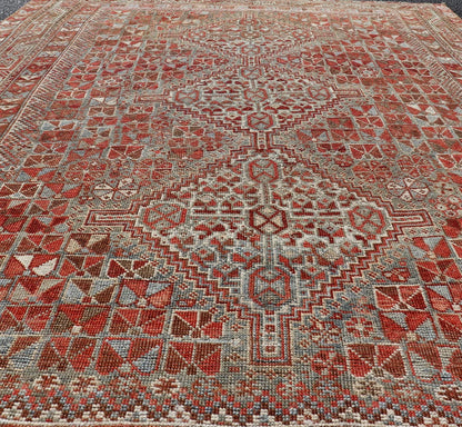 Antique Distressed Persian Medallion Shiraz Rug in Shades Rusty Red & Steel Blue. Keivan Woven Arts / rug EMB - 22190 - 15055, country of origin / type: Iran / Shiraz, circa 1910. Measures: 5'0 x 6'10 This antique distressed Persian Shiraz rug (circ... - Keivan Woven ArtsEMB - 22190 - 15055 - 20565