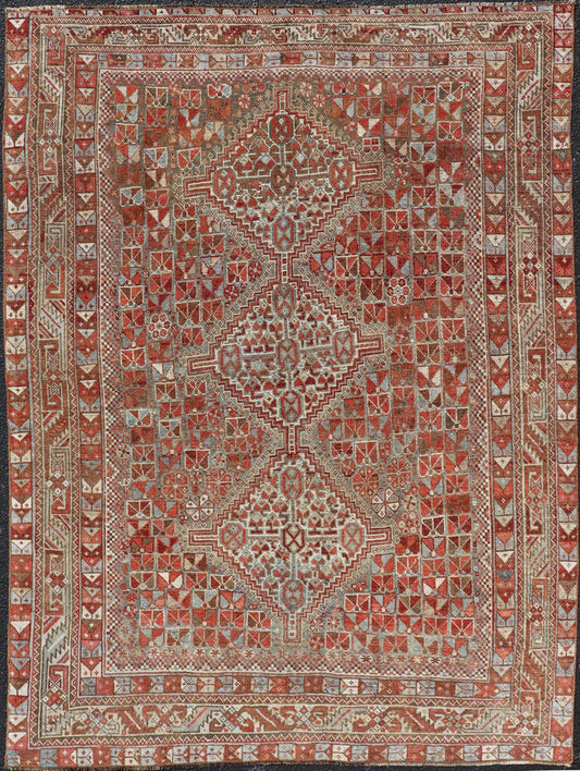 Antique Distressed Persian Medallion Shiraz Rug in Shades Rusty Red & Steel Blue. Keivan Woven Arts / rug EMB - 22190 - 15055, country of origin / type: Iran / Shiraz, circa 1910. Measures: 5'0 x 6'10 This antique distressed Persian Shiraz rug (circ... - Keivan Woven ArtsEMB - 22190 - 15055 - 20565Rug