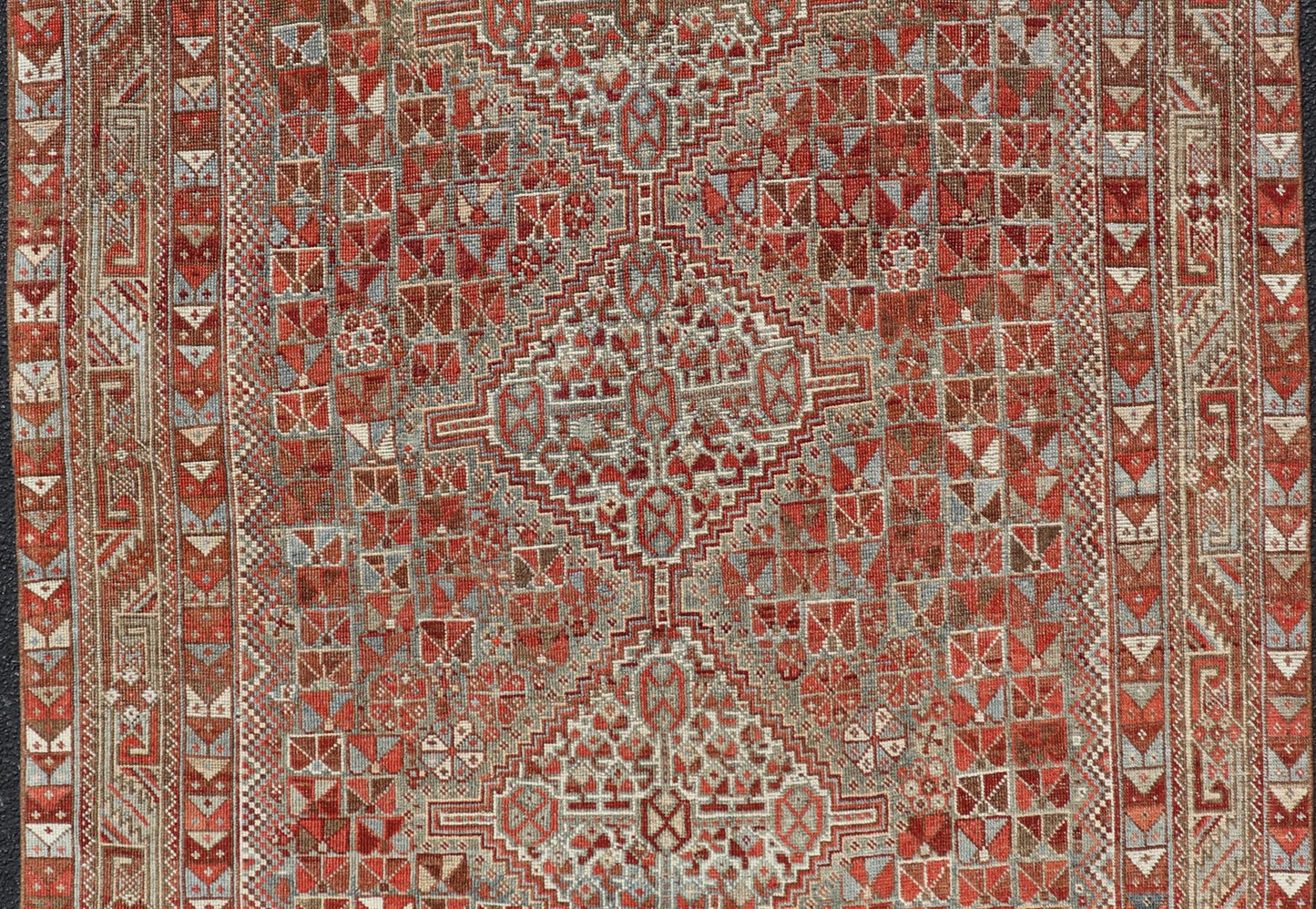 Antique Distressed Persian Medallion Shiraz Rug in Shades Rusty Red & Steel Blue. Keivan Woven Arts / rug EMB - 22190 - 15055, country of origin / type: Iran / Shiraz, circa 1910. Measures: 5'0 x 6'10 This antique distressed Persian Shiraz rug (circ... - Keivan Woven ArtsEMB - 22190 - 15055 - 20565