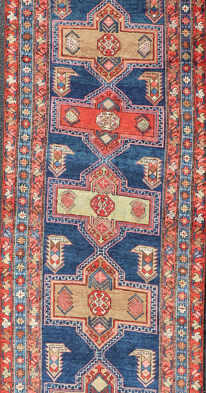Measures: 3'5 x 13'4 Bold Medallion Design Antique Persian Heriz Runner in Red and Blue Tones. Keivan Woven Arts / rug EMB - 22195 - 15097, country of origin / type: Iran / Heriz, circa 1910 This antique Persian Heriz runner, from northwest Iran... - Keivan Woven ArtsEMB - 22195 - 15097 - 20758Rug