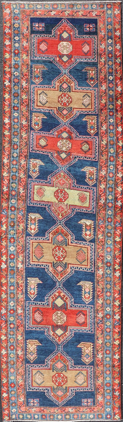 Measures: 3'5 x 13'4 Bold Medallion Design Antique Persian Heriz Runner in Red and Blue Tones. Keivan Woven Arts / rug EMB - 22195 - 15097, country of origin / type: Iran / Heriz, circa 1910 This antique Persian Heriz runner, from northwest Iran... - Keivan Woven ArtsEMB - 22195 - 15097 - 20758