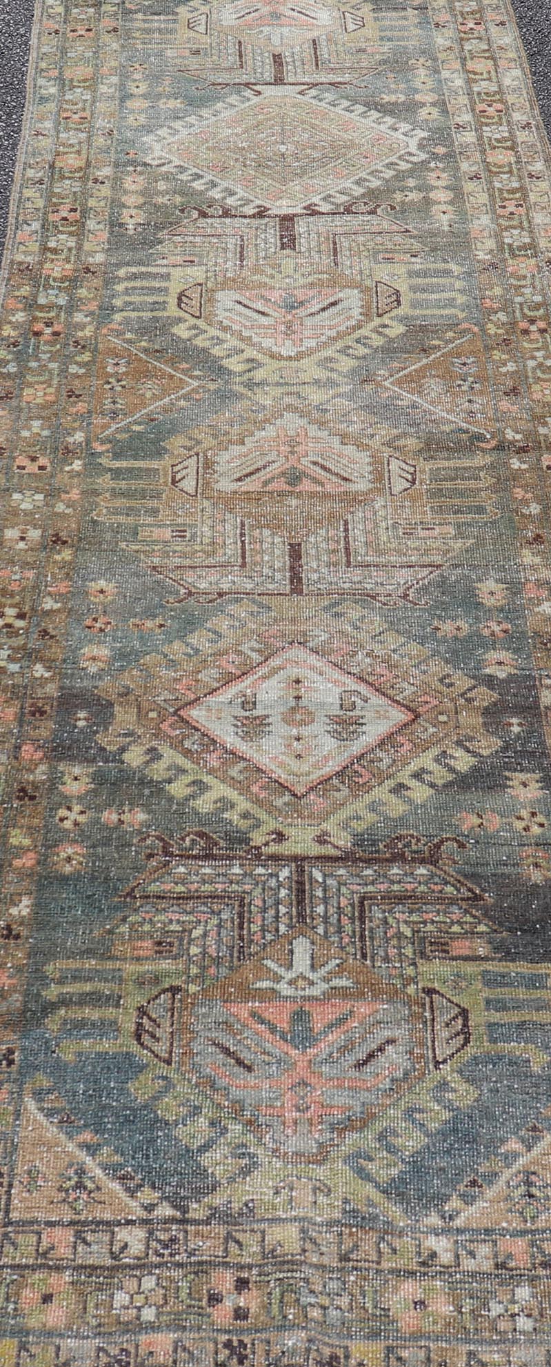 Heriz Antique Persian Rug with Geometric Medallions in Steal Blue, Brown & Peach. Keivan Woven Arts / rug EMB - 22204 - 15460, country of origin / type: Iran / Heriz Serapi, circa 1900 Measures: 3'1 x 13'10 This magnificent Heriz runner woven in the... - Keivan Woven ArtsEMB - 22204 - 15460 - 21125