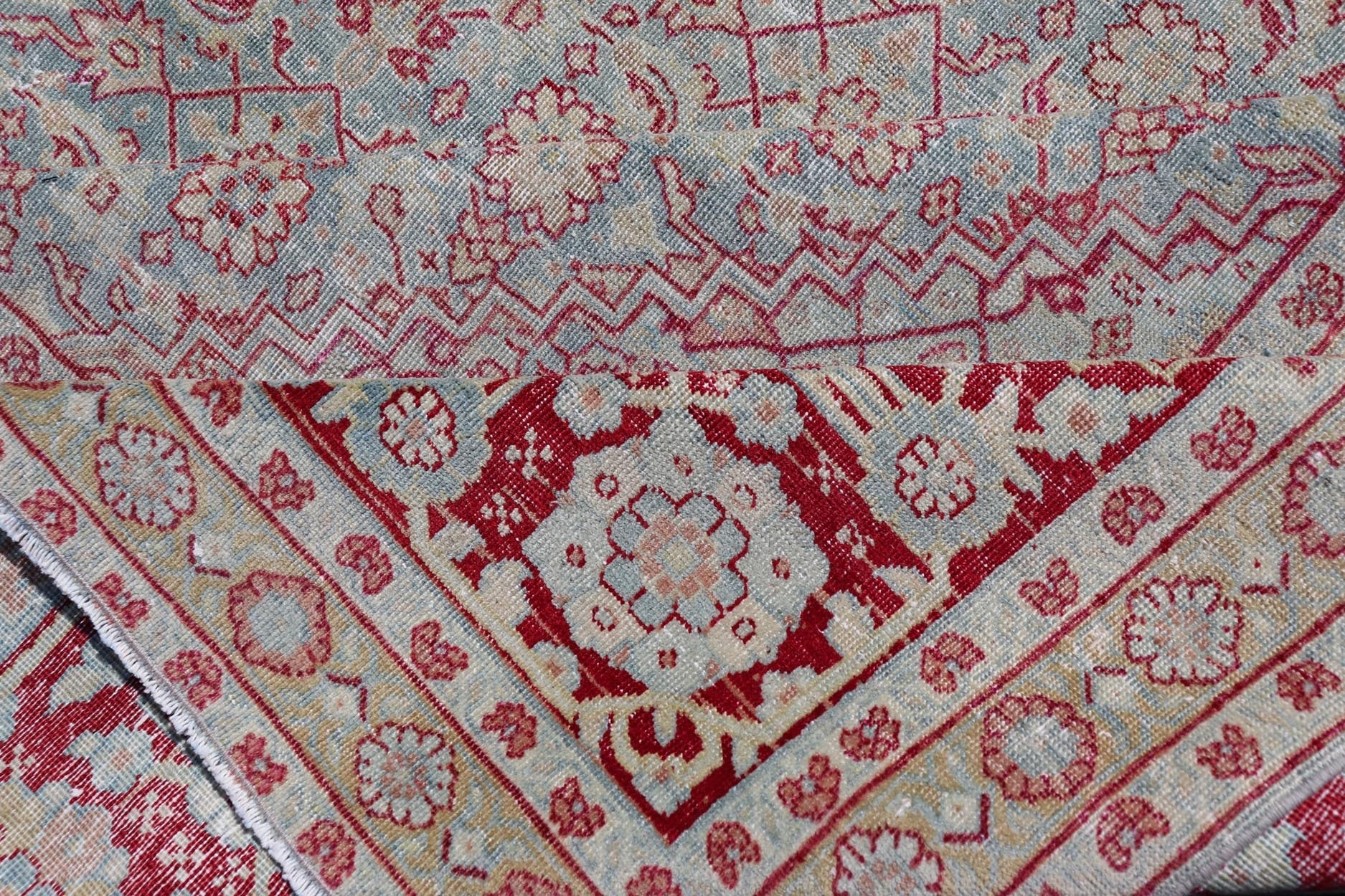 Antique Persian Tabriz Rug with All - Over Herati Design on Blue Field. Keivan Woven Arts / rug EMB - 222201 - 15458, country of origin / type: Iran / Tabriz , circa 1920. Measures: 10'5 x 13'5 This incredible antique distressed Persian Tabriz rug wa... - Keivan Woven ArtsEMB - 222201 - 15458 - 21149Rug