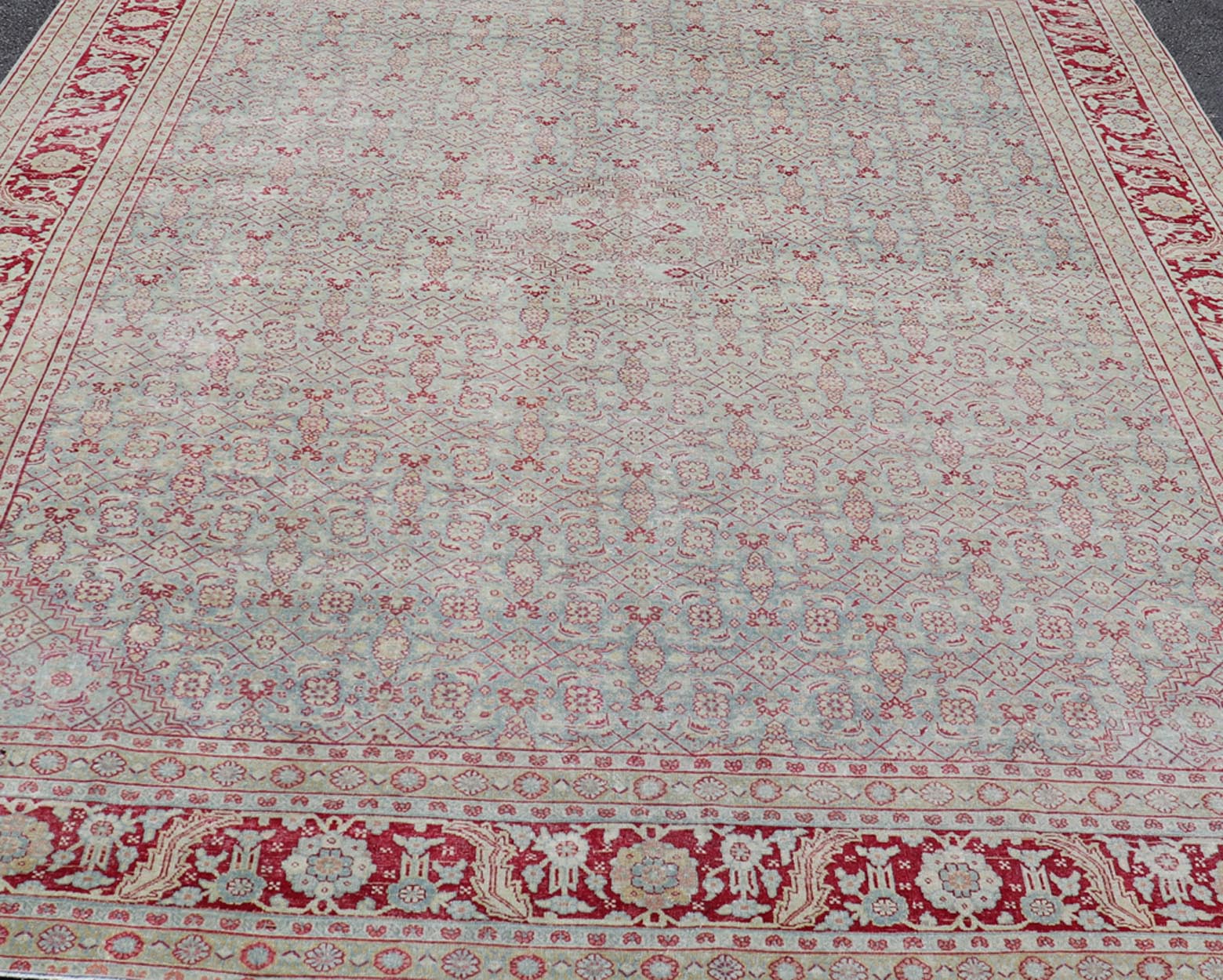 Antique Persian Tabriz Rug with All - Over Herati Design on Blue Field. Keivan Woven Arts / rug EMB - 222201 - 15458, country of origin / type: Iran / Tabriz , circa 1920. Measures: 10'5 x 13'5 This incredible antique distressed Persian Tabriz rug wa... - Keivan Woven ArtsEMB - 222201 - 15458 - 21149Rug