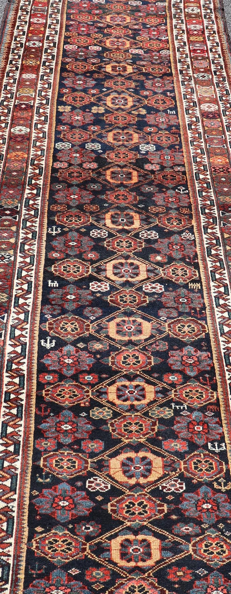 Colorful Antique Persian Lori Runner with Repeating Floral Palmette Design. Keivan Woven Arts / rug EMB - 22229 - 15464, country of origin / type: Iran / Lori, circa 1920 Measures: 3'6 x 11 This antique Persian Lori runner, circa early 20th cent... - Keivan Woven ArtsEMB - 22229 - 15464 - 21585Rug