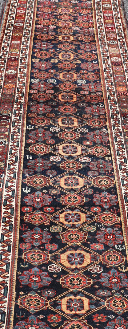 Colorful Antique Persian Lori Runner with Repeating Floral Palmette Design. Keivan Woven Arts / rug EMB - 22229 - 15464, country of origin / type: Iran / Lori, circa 1920 Measures: 3'6 x 11 This antique Persian Lori runner, circa early 20th cent... - Keivan Woven ArtsEMB - 22229 - 15464 - 21585Rug