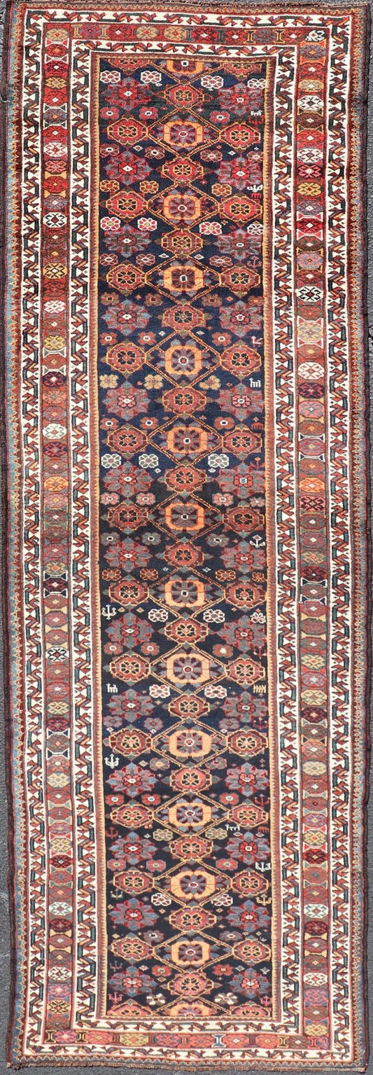 Colorful Antique Persian Lori Runner with Repeating Floral Palmette Design. Keivan Woven Arts / rug EMB - 22229 - 15464, country of origin / type: Iran / Lori, circa 1920 Measures: 3'6 x 11 This antique Persian Lori runner, circa early 20th cent... - Keivan Woven ArtsEMB - 22229 - 15464 - 21585Rug