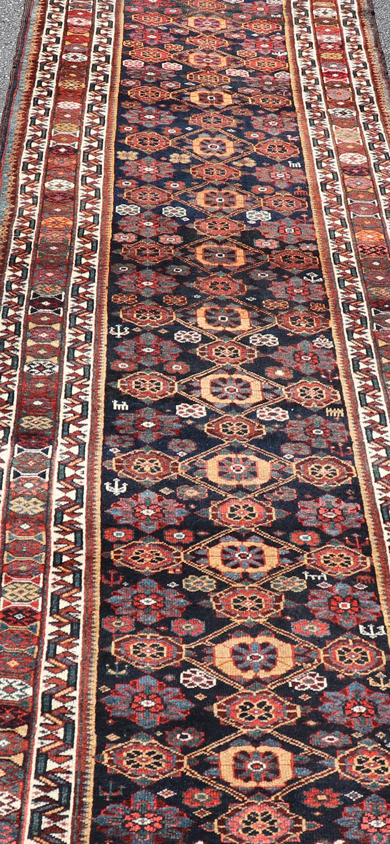 Colorful Antique Persian Lori Runner with Repeating Floral Palmette Design. Keivan Woven Arts / rug EMB - 22229 - 15464, country of origin / type: Iran / Lori, circa 1920 Measures: 3'6 x 11 This antique Persian Lori runner, circa early 20th cent... - Keivan Woven ArtsEMB - 22229 - 15464 - 21585Rug