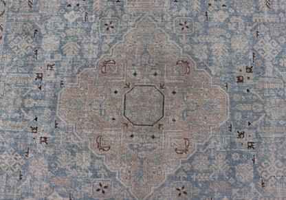 Measures: 6'0 x 9'0 The rug's central field is highlighted by a soft blue background adorned with a detailed medallion pattern in shades of beige and ivory. The design includes various geometric and floral motifs that are arranged symmetrically, cr... - Keivan Woven ArtsEMB - 22236 - 22460Rug