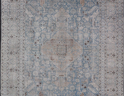 Measures: 6'0 x 9'0 The rug's central field is highlighted by a soft blue background adorned with a detailed medallion pattern in shades of beige and ivory. The design includes various geometric and floral motifs that are arranged symmetrically, cr... - Keivan Woven ArtsEMB - 22236 - 22460Rug