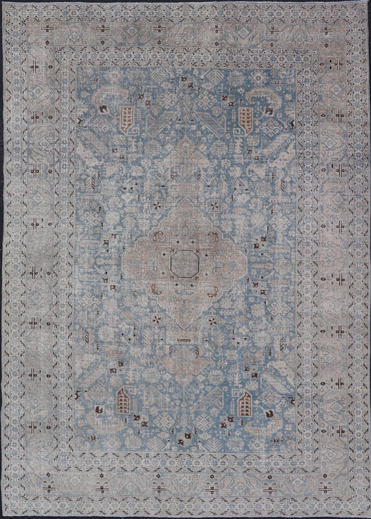 Measures: 6'0 x 9'0 The rug's central field is highlighted by a soft blue background adorned with a detailed medallion pattern in shades of beige and ivory. The design includes various geometric and floral motifs that are arranged symmetrically, cr... - Keivan Woven ArtsEMB - 22236 - 22460
