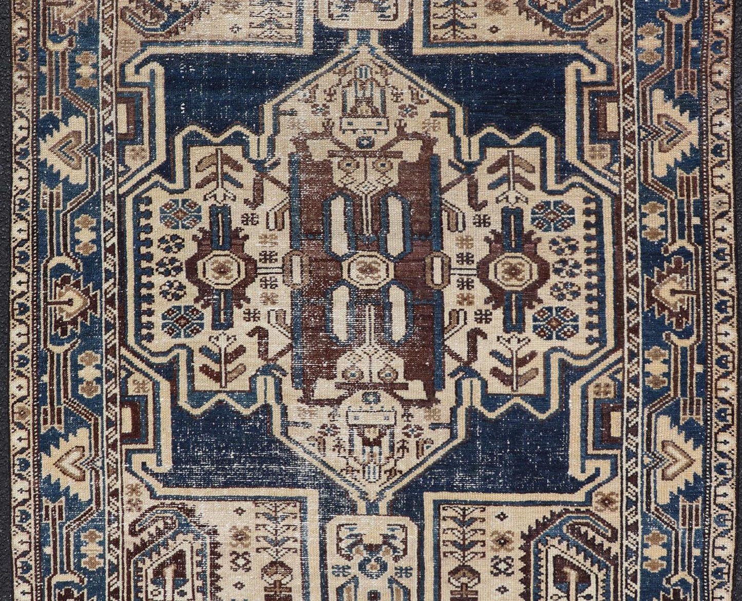 Measures: 4'4 x 6'9 The rug's central field showcases a prominent medallion pattern set against a deep blue background, accented with beige and brown geometric and floral motifs. The medallion itself is highly detailed, featuring a complex arrangem... - Keivan Woven ArtsEMB - 22237 - 22466
