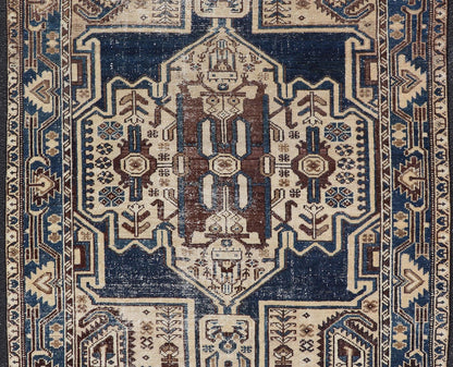 Measures: 4'4 x 6'9 The rug's central field showcases a prominent medallion pattern set against a deep blue background, accented with beige and brown geometric and floral motifs. The medallion itself is highly detailed, featuring a complex arrangem... - Keivan Woven ArtsEMB - 22237 - 22466