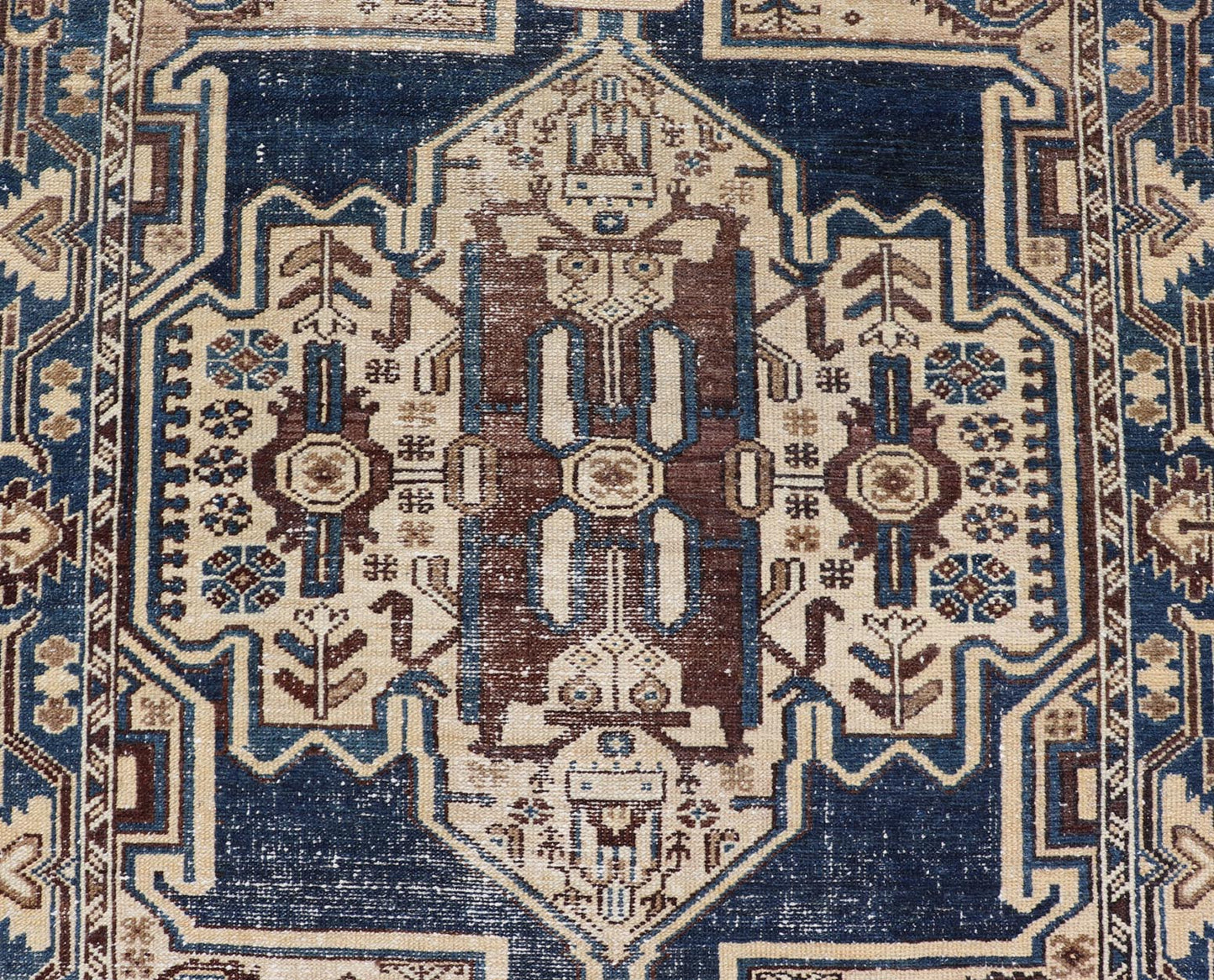 Measures: 4'4 x 6'9 The rug's central field showcases a prominent medallion pattern set against a deep blue background, accented with beige and brown geometric and floral motifs. The medallion itself is highly detailed, featuring a complex arrangem... - Keivan Woven ArtsEMB - 22237 - 22466
