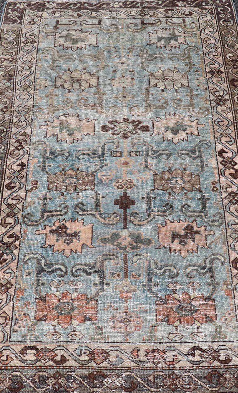 Measures: 2'11 x 4'11 The rug's central field is characterized by a soft blue background with intricate geometric and floral motifs in shades of beige, brown, and cream. The symmetrical patterns include stylized flowers and abstract shapes, creatin... - Keivan Woven ArtsEMB - 22238 - 22472