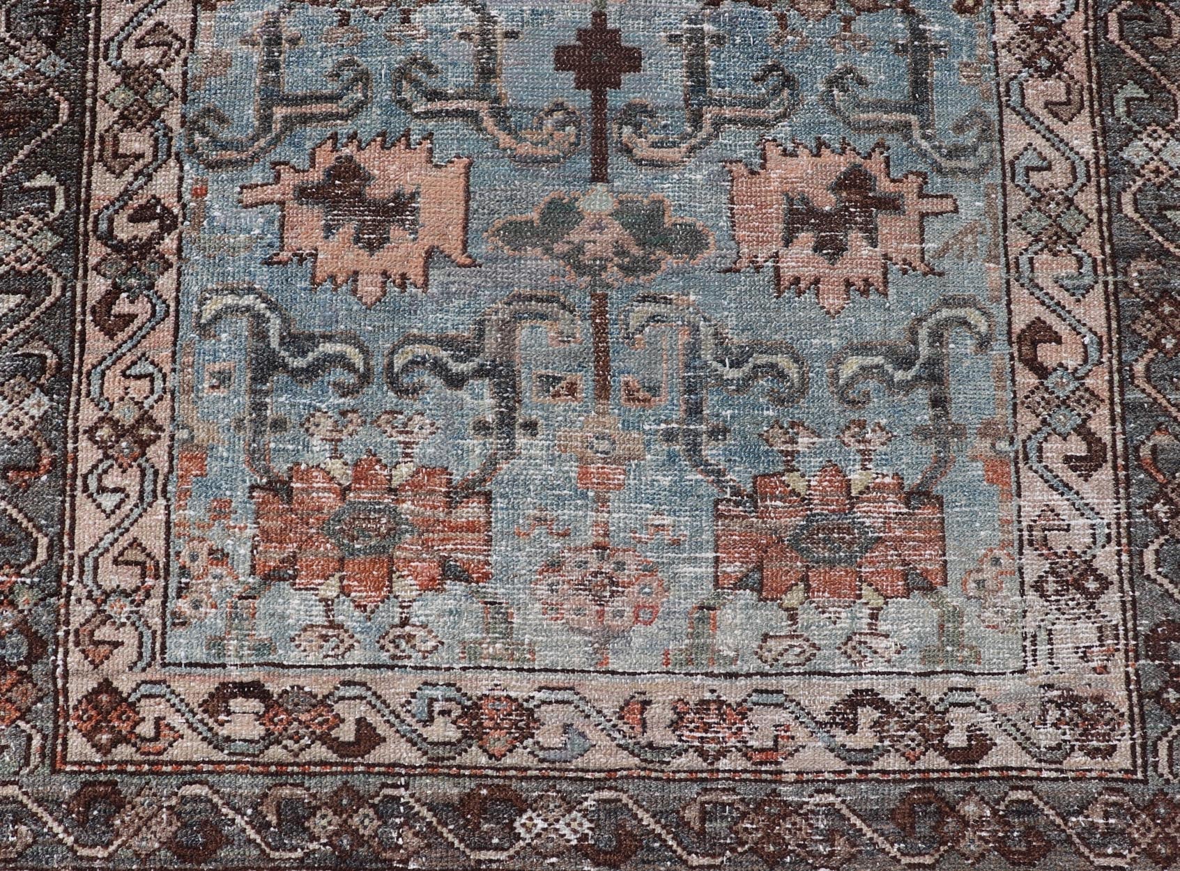 Measures: 2'11 x 4'11 The rug's central field is characterized by a soft blue background with intricate geometric and floral motifs in shades of beige, brown, and cream. The symmetrical patterns include stylized flowers and abstract shapes, creatin... - Keivan Woven ArtsEMB - 22238 - 22472