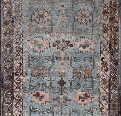 Measures: 2'11 x 4'11 The rug's central field is characterized by a soft blue background with intricate geometric and floral motifs in shades of beige, brown, and cream. The symmetrical patterns include stylized flowers and abstract shapes, creatin... - Keivan Woven ArtsEMB - 22238 - 22472