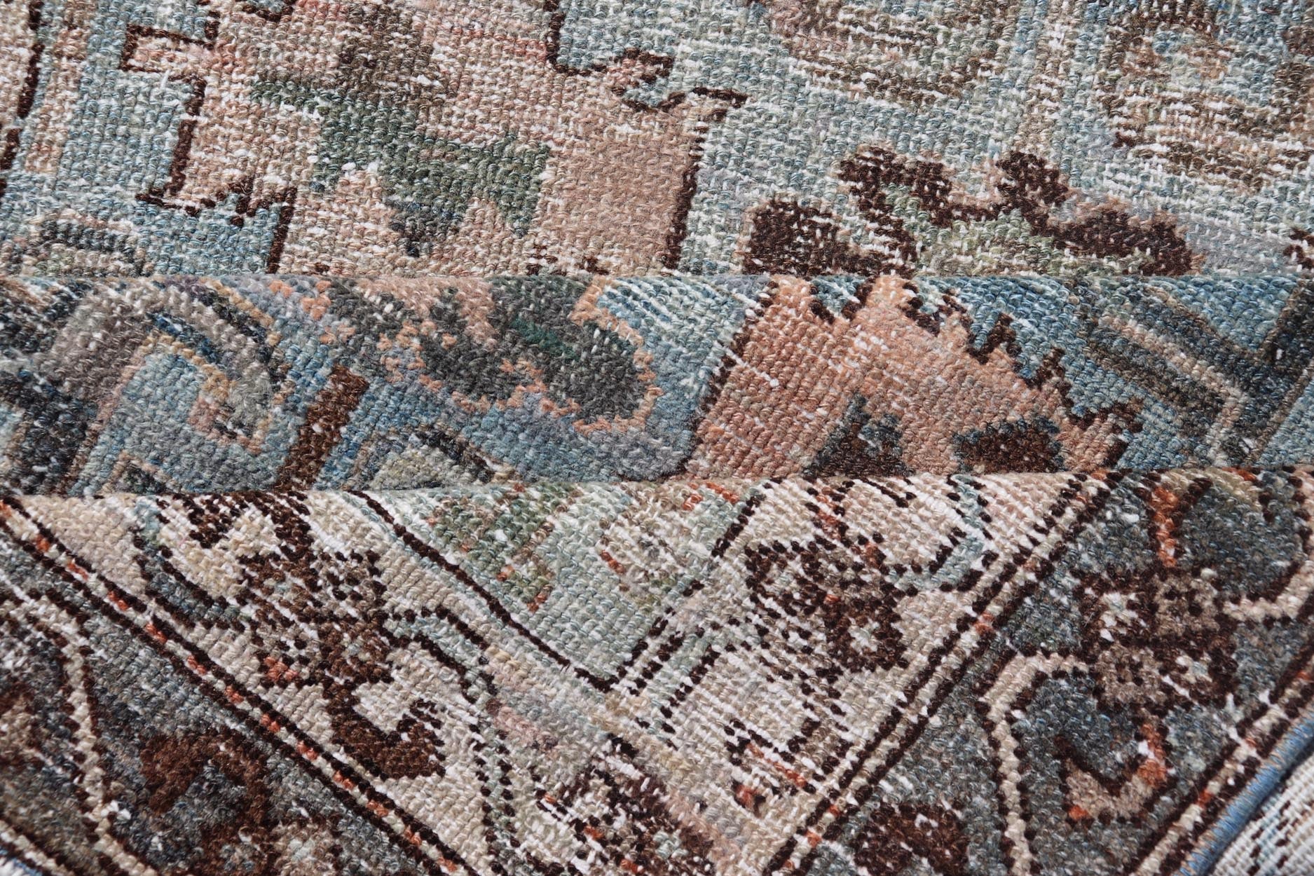 Measures: 2'11 x 4'11 The rug's central field is characterized by a soft blue background with intricate geometric and floral motifs in shades of beige, brown, and cream. The symmetrical patterns include stylized flowers and abstract shapes, creatin... - Keivan Woven ArtsEMB - 22238 - 22472
