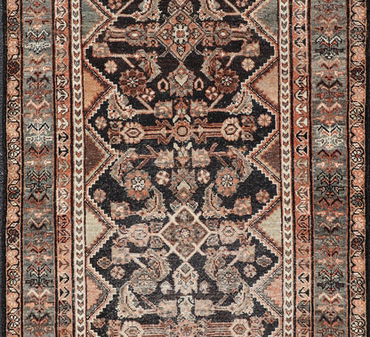 Measures: 3'6 x 6'4 The rug's central field features a dark background adorned with detailed floral and geometric motifs in shades of beige, brown, and soft orange. The design is symmetrical, with a central medallion and repeating patterns that cre... - Keivan Woven ArtsEMB - 22239 - 22478