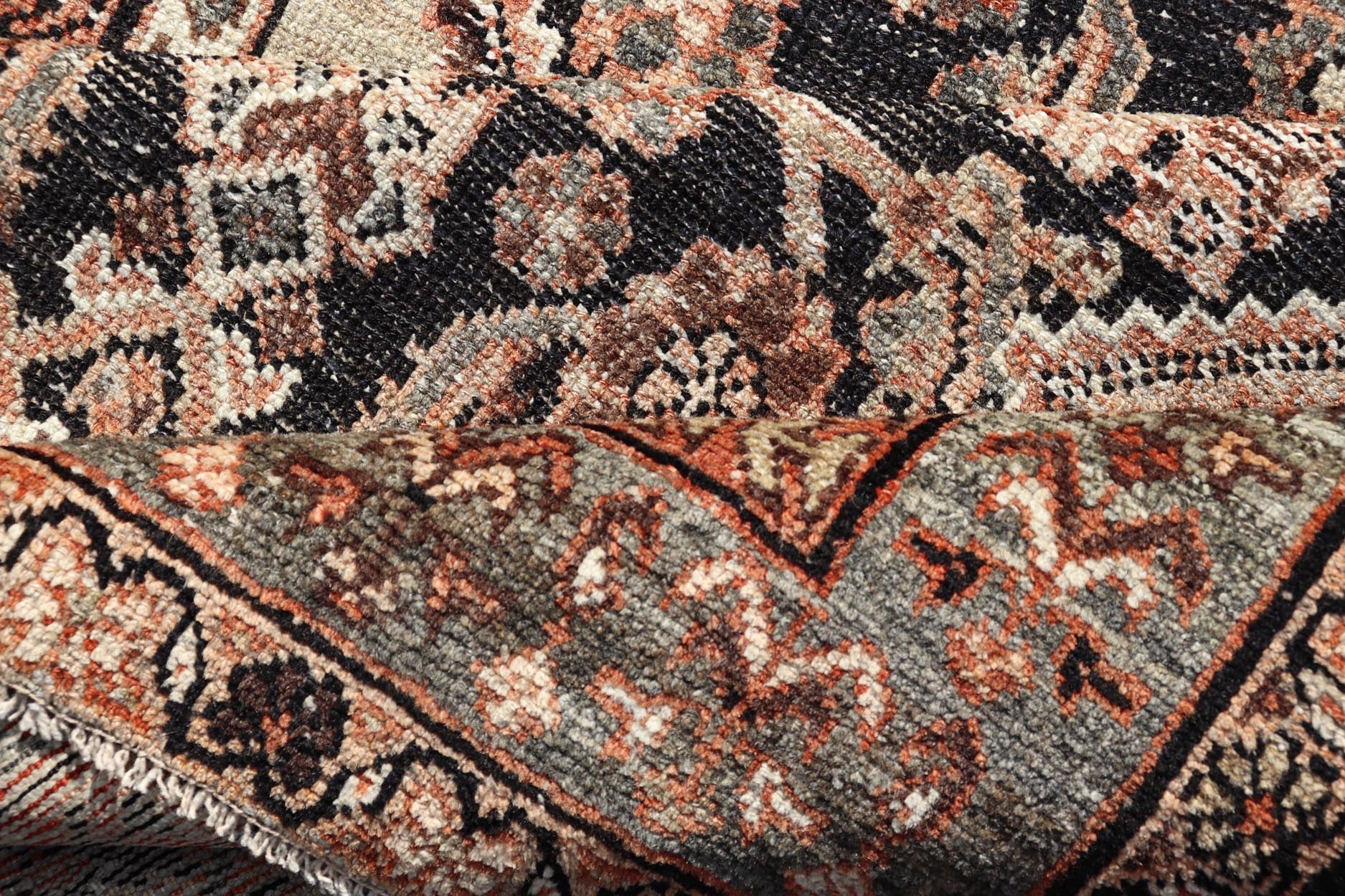 Measures: 3'6 x 6'4 The rug's central field features a dark background adorned with detailed floral and geometric motifs in shades of beige, brown, and soft orange. The design is symmetrical, with a central medallion and repeating patterns that cre... - Keivan Woven ArtsEMB - 22239 - 22478