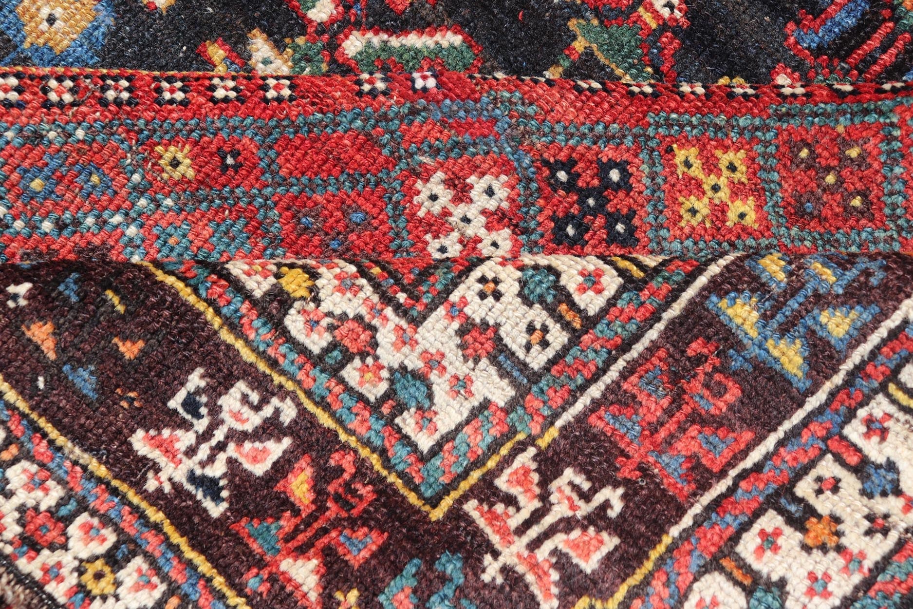 Measures: 5'7 x 8'10 This Qashgai rug has rich heritage and intricate design characteristic of this nomadic tribe from southwestern Iran. The rug features a dense, dark blue field adorned with a myriad of vibrant, detailed motifs, including ani... - Keivan Woven ArtsEMB - 22245 - 22508