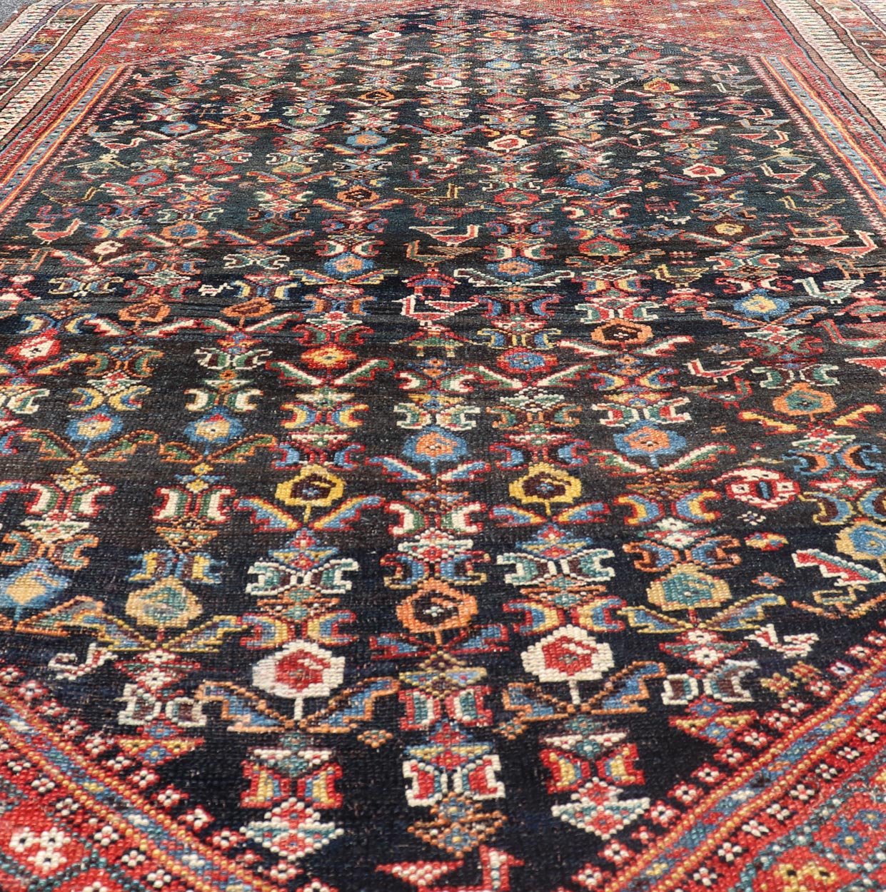 Measures: 5'7 x 8'10 This Qashgai rug has rich heritage and intricate design characteristic of this nomadic tribe from southwestern Iran. The rug features a dense, dark blue field adorned with a myriad of vibrant, detailed motifs, including ani... - Keivan Woven ArtsEMB - 22245 - 22508