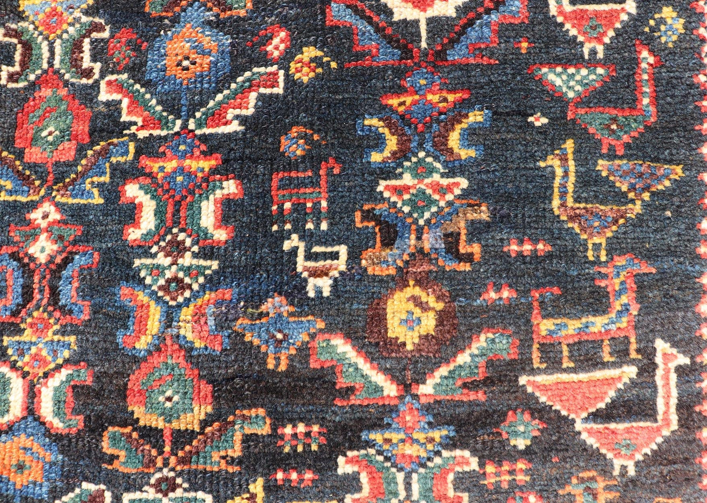 Measures: 5'7 x 8'10 This Qashgai rug has rich heritage and intricate design characteristic of this nomadic tribe from southwestern Iran. The rug features a dense, dark blue field adorned with a myriad of vibrant, detailed motifs, including ani... - Keivan Woven ArtsEMB - 22245 - 22508