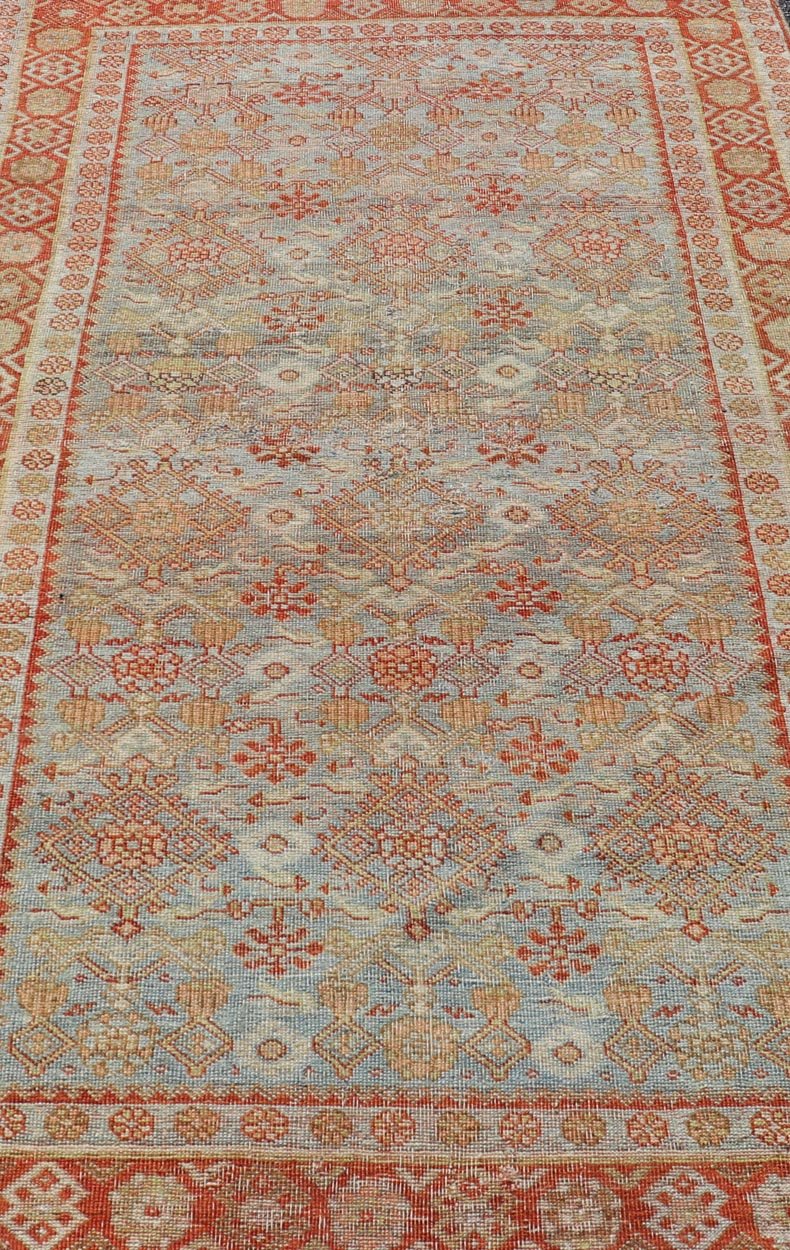 Measures: 4'3 x 7'5 This exquisite Antique Bidjar rug exemplifies the grandeur and meticulous craftsmanship synonymous with one of the most durable Persian carpets. The rug features a harmonious blend of sky blue and rusty red hues, providing a stu... - Keivan Woven ArtsEMB - 22246 - 22514Rug