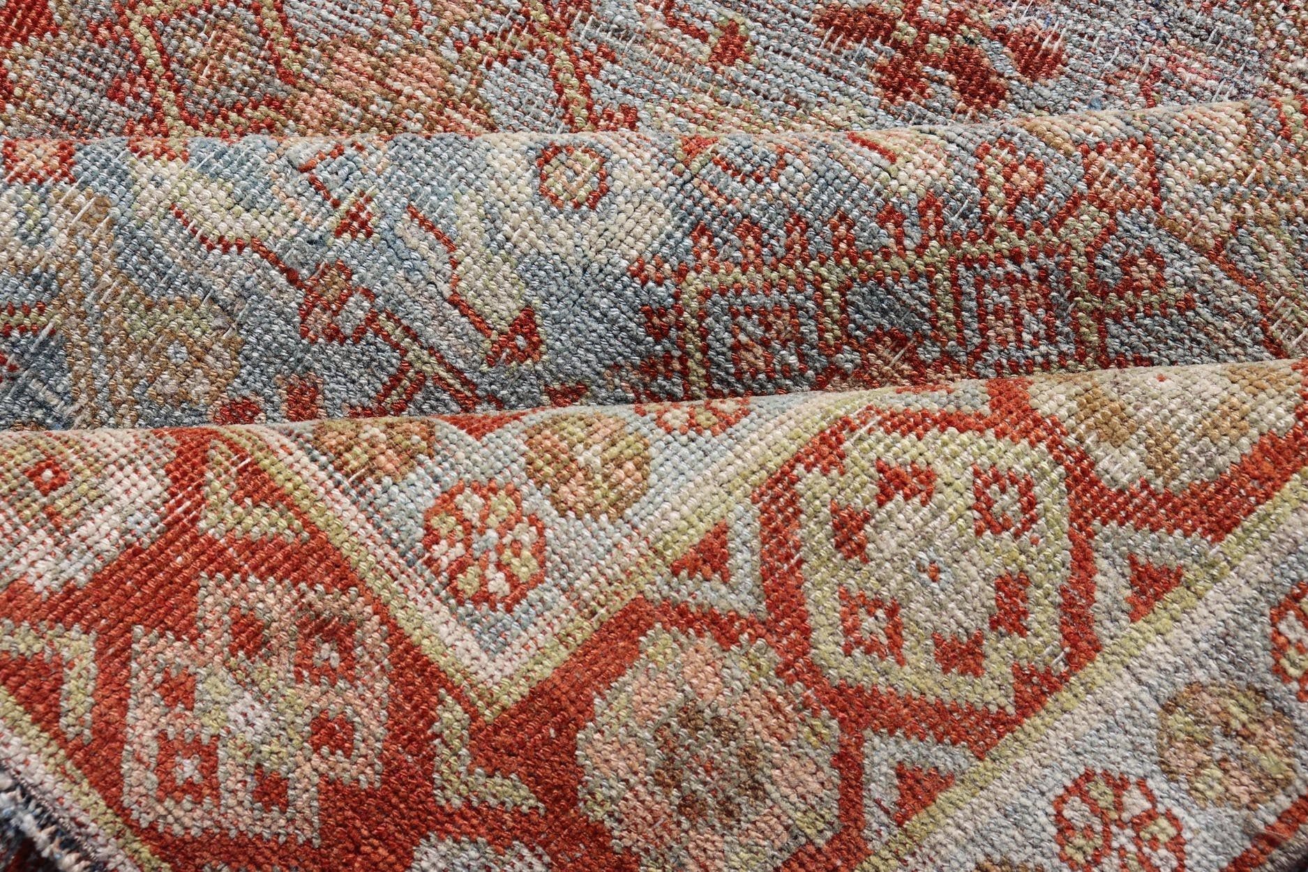 Measures: 4'3 x 7'5 This exquisite Antique Bidjar rug exemplifies the grandeur and meticulous craftsmanship synonymous with one of the most durable Persian carpets. The rug features a harmonious blend of sky blue and rusty red hues, providing a stu... - Keivan Woven ArtsEMB - 22246 - 22514Rug