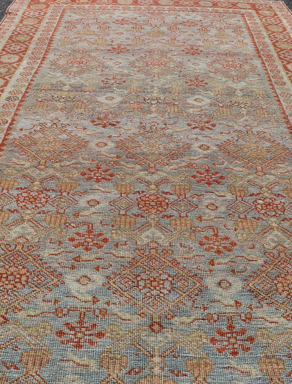 Measures: 4'3 x 7'5 This exquisite Antique Bidjar rug exemplifies the grandeur and meticulous craftsmanship synonymous with one of the most durable Persian carpets. The rug features a harmonious blend of sky blue and rusty red hues, providing a stu... - Keivan Woven ArtsEMB - 22246 - 22514Rug