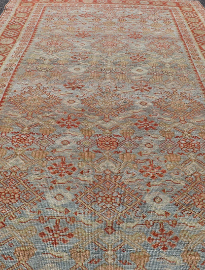Measures: 4'3 x 7'5 This exquisite Antique Bidjar rug exemplifies the grandeur and meticulous craftsmanship synonymous with one of the most durable Persian carpets. The rug features a harmonious blend of sky blue and rusty red hues, providing a stu... - Keivan Woven ArtsEMB - 22246 - 22514Rug