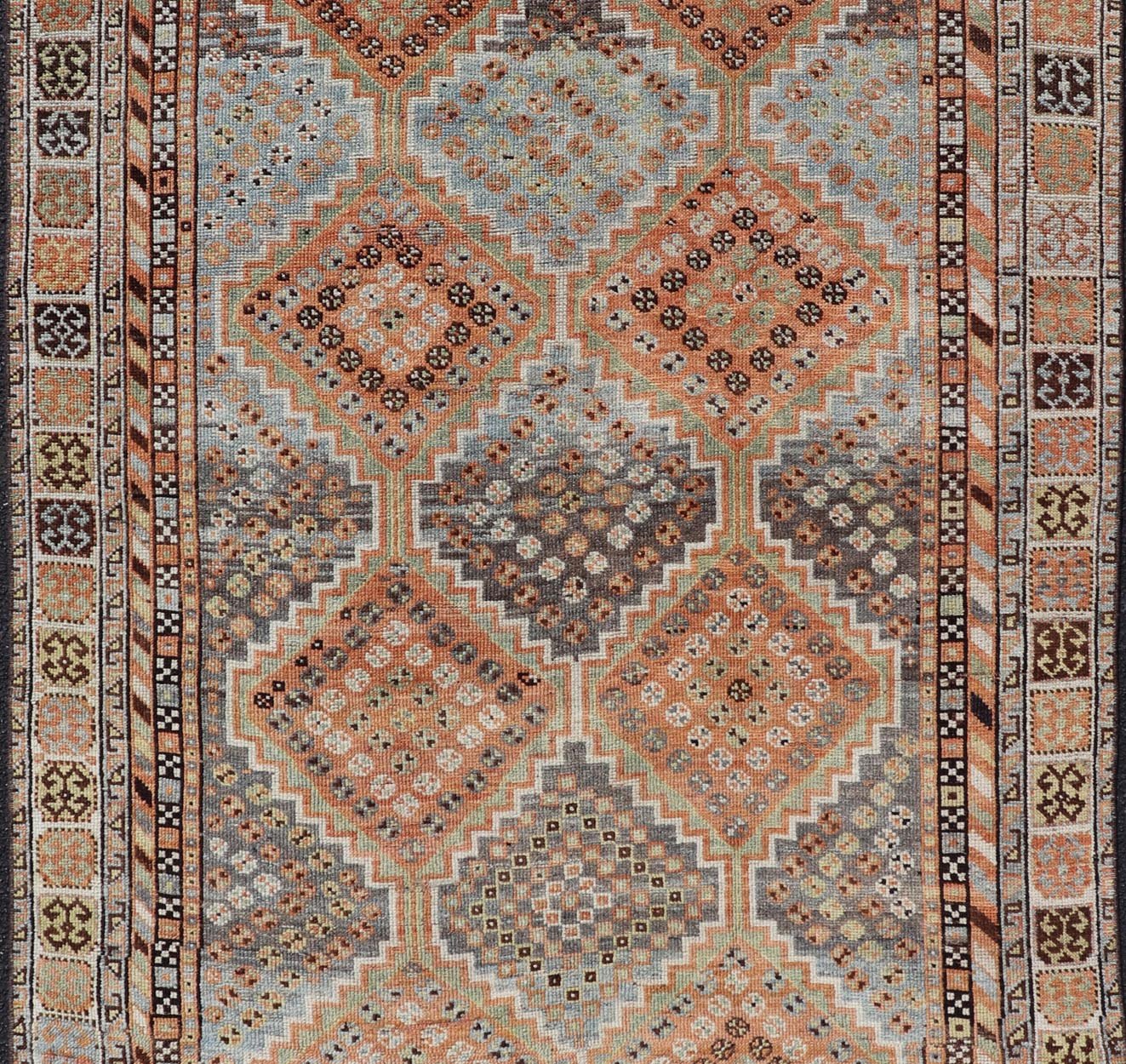 Measures: 4'7 x 8'0 This exquisite antique Shiraz rug features a striking geometric diamond motif, characteristic of the rich weaving tradition of the Shiraz region in southwestern Iran. The central field is adorned with a series of interconnected ... - Keivan Woven ArtsEMB - 22249 - 22520