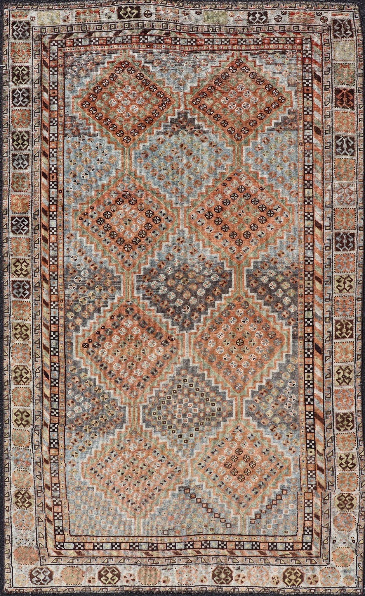 Measures: 4'7 x 8'0 This exquisite antique Shiraz rug features a striking geometric diamond motif, characteristic of the rich weaving tradition of the Shiraz region in southwestern Iran. The central field is adorned with a series of interconnected ... - Keivan Woven ArtsEMB - 22249 - 22520